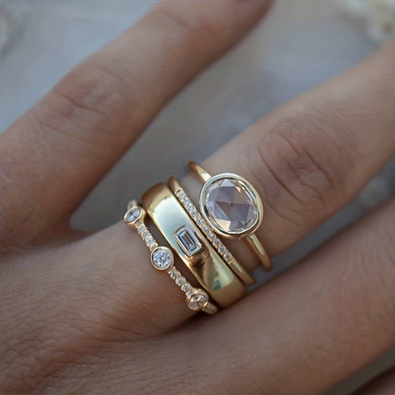 Oval Bezel Crystal and Baguette CZ Gold Tone Stacking Ring Set